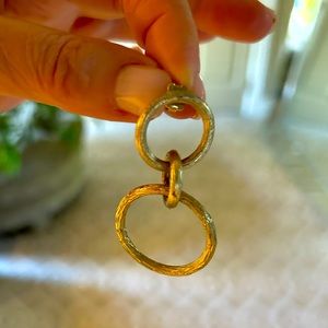 Gold hoop earrings. Textural